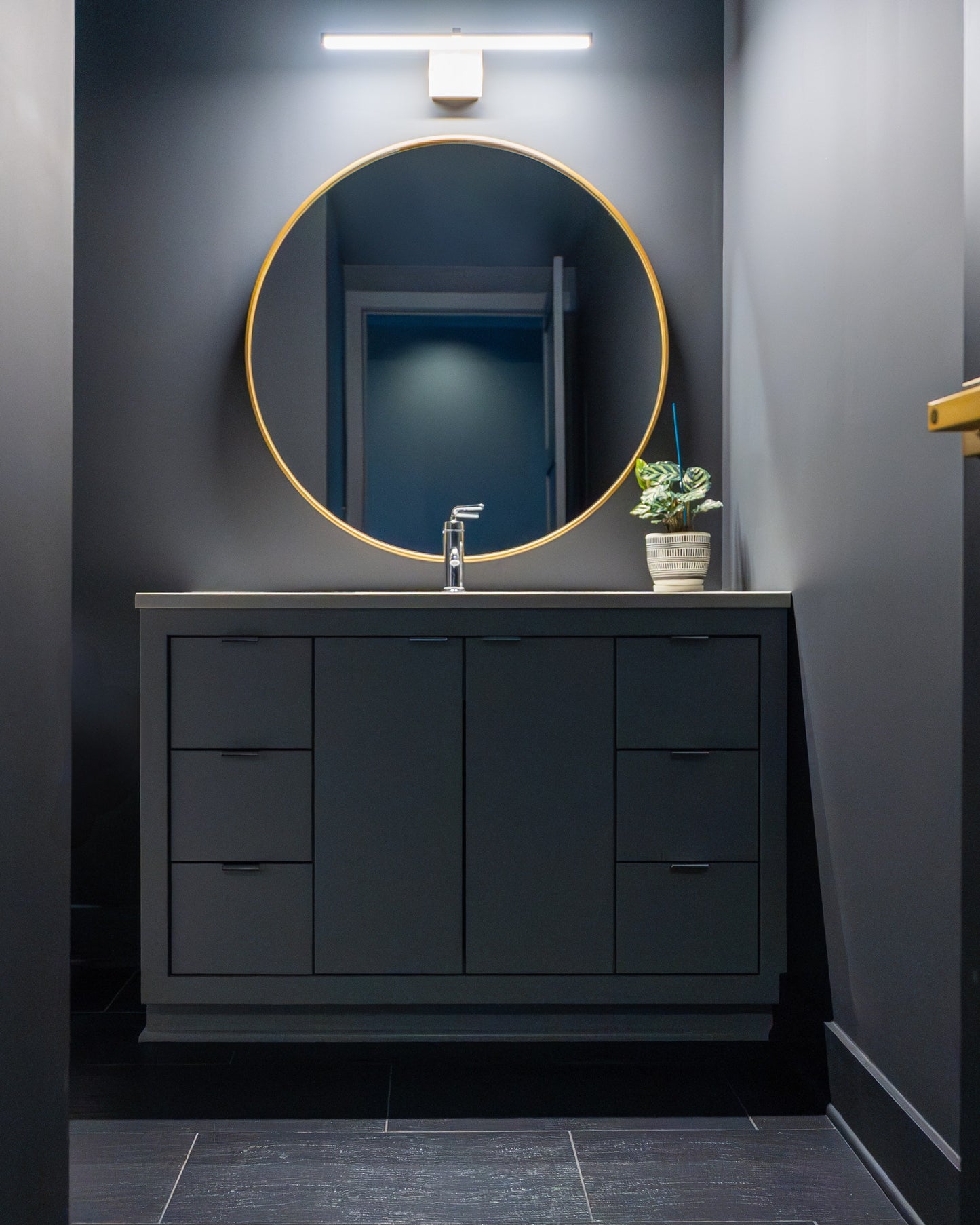 Gilded floating bath vanity, styled bathroom