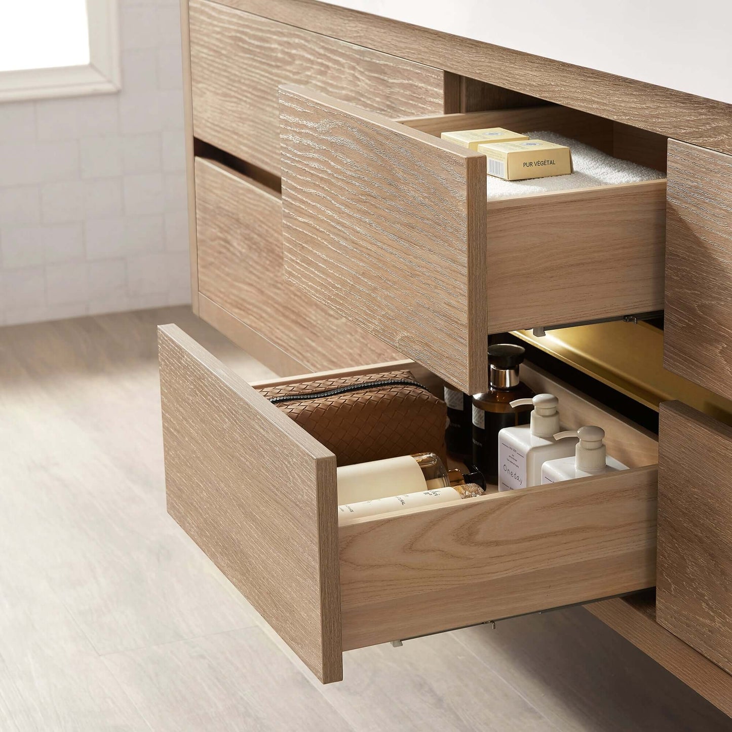 Open drawers of the Vinnova, Palencia 84" Double Sink Wall-Mount Bath Vanity in North American Oak, showcasing bathroom storage.
