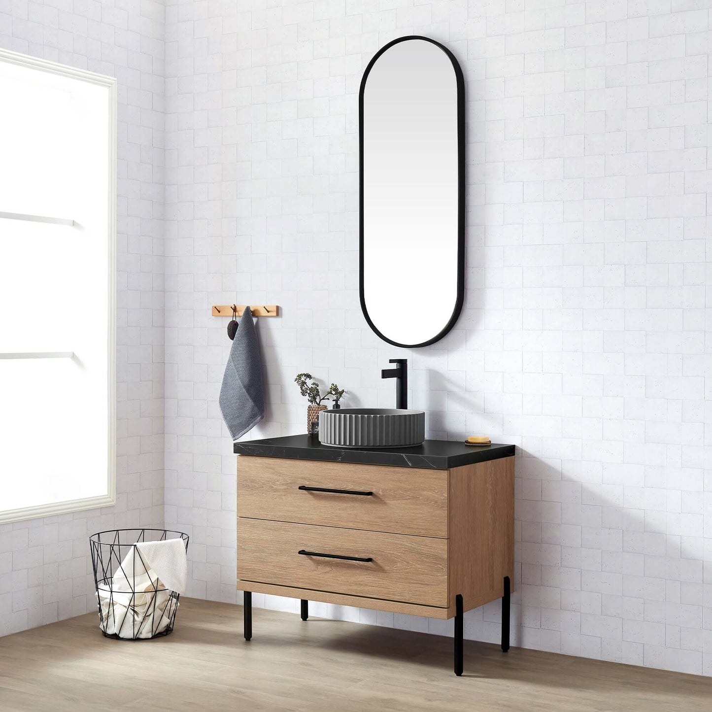Vinnova, Trento 36B" Single Sink Bath Vanity in North American Oak with Black Sintered Stone Top and Mirror in a modern bathroom.